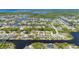 Aerial shot featuring waterfront homes that have boat docks, and direct gulf access at 4122 Library St, Port Charlotte, FL 33948