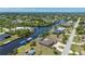Aerial view of the waterfront community featuring private boat docks and Gulf access at 4122 Library St, Port Charlotte, FL 33948