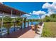 Waterfront dock features a boat lift, covered area, and lounge chairs overlooking the canal at 4122 Library St, Port Charlotte, FL 33948