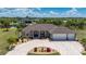 Charming home boasts a three-car garage, well-manicured lawn and tasteful landscaping at 4122 Library St, Port Charlotte, FL 33948