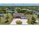 Stunning single-Gathering home with circular driveway, lush landscaping and screened-in lanai at 4122 Library St, Port Charlotte, FL 33948