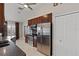 Kitchen with dark wood cabinets and stainless steel appliances at 4122 Library St, Port Charlotte, FL 33948