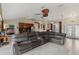Spacious living room with open access to the kitchen and a view into the bedroom at 4122 Library St, Port Charlotte, FL 33948