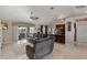 Open concept living room featuring a large sectional sofa and seamless access to the kitchen at 4122 Library St, Port Charlotte, FL 33948