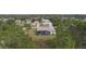 A stunning aerial view showcases a beautiful neighborhood surrounded by lush greenery and a peaceful atmosphere at 5435 Montego Ln, Port Charlotte, FL 33981