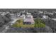 Monochrome aerial view of a house with a screened-in pool highlighting its location and neighborhood at 5435 Montego Ln, Port Charlotte, FL 33981