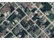 Overhead view of property featuring lush landscaping and a peaceful neighborhood setting at 5435 Montego Ln, Port Charlotte, FL 33981