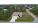 A stunning aerial view showcases the property's landscaped grounds and proximity to lush greenery at 5435 Montego Ln, Port Charlotte, FL 33981