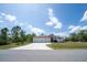 Charming single-story home with a three-car garage and well-manicured front lawn at 5435 Montego Ln, Port Charlotte, FL 33981