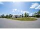 Single-story home on corner lot features a three-car garage and lush green lawn at 5435 Montego Ln, Port Charlotte, FL 33981
