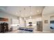 Elegant kitchen with white cabinets, granite counters, stainless appliances, and island seating at 5435 Montego Ln, Port Charlotte, FL 33981