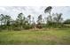 A vast, well-manicured lawn adds to the property's appeal, offering space and a connection to nature at 5435 Montego Ln, Port Charlotte, FL 33981