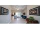 An open-concept living room flows to the dining area with modern lighting, neutral paint, and an expansive view at 5435 Montego Ln, Port Charlotte, FL 33981