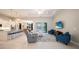 An open-concept living room flowing to the kitchen features recessed lights, neutral paint, and an expansive view at 5435 Montego Ln, Port Charlotte, FL 33981