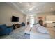An expansive living room has recessed lights and access to the front of the home and an open kitchen at 5435 Montego Ln, Port Charlotte, FL 33981