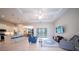 The expansive and bright living room has recessed lights, an open floor plan, and access to the screened in porch at 5435 Montego Ln, Port Charlotte, FL 33981