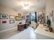 Office with ceiling fan, neutral paint, a bright window, and light-colored wood-look flooring at 5435 Montego Ln, Port Charlotte, FL 33981