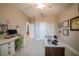 Bright office space with a ceiling fan, light walls, wood-look flooring, and natural light at 5435 Montego Ln, Port Charlotte, FL 33981