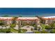 A beautiful waterfront condo complex with red tile roofs and manicured landscaping provides luxurious coastal living at 89 Vivante Blvd # 205, Punta Gorda, FL 33950