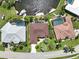 An aerial view of homes featuring private pools, boat docks, manicured lawns, and direct access to waterfront canals and boating at 3663 Whippoorwill Blvd, Punta Gorda, FL 33950