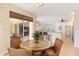 Open concept dining area leading to the kitchen and living room, promoting a sense of togetherness at 3663 Whippoorwill Blvd, Punta Gorda, FL 33950