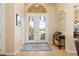 Elegant foyer with double doors and transom window, leading into the bright, open-concept living space at 3663 Whippoorwill Blvd, Punta Gorda, FL 33950