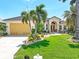 Beautiful single-story home featuring a spacious three-car garage and mature, tropical landscaping at 3663 Whippoorwill Blvd, Punta Gorda, FL 33950