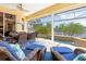 Spacious lanai featuring multiple seating areas, dining, and overlooking a pool and waterfront, ideal for entertainment at 3663 Whippoorwill Blvd, Punta Gorda, FL 33950