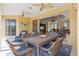 Expansive lanai featuring dining and seating areas, perfect for entertaining with views to the living room at 3663 Whippoorwill Blvd, Punta Gorda, FL 33950
