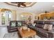 A wide open living area has leather sofas and plenty of room to relax at 3663 Whippoorwill Blvd, Punta Gorda, FL 33950
