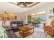 Open-concept living area with tray ceilings flows seamlessly to the lanai and waterfront views at 3663 Whippoorwill Blvd, Punta Gorda, FL 33950