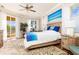 Inviting main bedroom with a waterfront view, elegant decor, and plush bedding at 3663 Whippoorwill Blvd, Punta Gorda, FL 33950