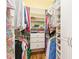 Well-organized walk-in closet with shelving, drawers, and ample hanging space for clothes at 3663 Whippoorwill Blvd, Punta Gorda, FL 33950
