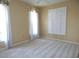 Comfortable bedroom with carpet, natural light from windows with shutters, and neutral wall colors at 3932 Madrid Ct, Punta Gorda, FL 33950