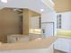 Bright kitchen with white cabinets, an island cooktop, and breakfast bar offering a functional and stylish space at 3932 Madrid Ct, Punta Gorda, FL 33950