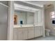 Clean bathroom with double sink vanity and modern fixtures at 4046 Lubec Ave, North Port, FL 34287
