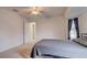 Cozy bedroom featuring carpet floors and a ceiling fan at 4046 Lubec Ave, North Port, FL 34287