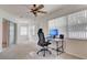 Bright bedroom with a ceiling fan, plush carpet and large windows at 4046 Lubec Ave, North Port, FL 34287