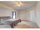 Spacious bedroom with a ceiling fan, carpet floors, and lots of natural light at 4046 Lubec Ave, North Port, FL 34287