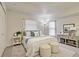 Cozy bedroom features a comfortable bed, soft lighting, and neutral decor, creating a warm and inviting space at 4046 Lubec Ave, North Port, FL 34287