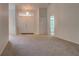 Inviting foyer featuring double front doors, chandelier lighting, and an open layout, creating a welcoming entrance at 4046 Lubec Ave, North Port, FL 34287