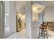 Well-lit kitchen with stainless steel refrigerator and convenient breakfast bar at 4046 Lubec Ave, North Port, FL 34287