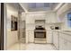 Modern kitchen featuring stainless steel appliances and ample white cabinetry at 4046 Lubec Ave, North Port, FL 34287