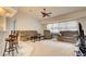 Cozy living room with comfortable seating and adjoining breakfast bar at 4046 Lubec Ave, North Port, FL 34287