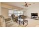 Comfortable living room with ceiling fan and neutral-toned furnishings at 4046 Lubec Ave, North Port, FL 34287