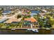 Aerial view showing the home with a private pool, boat dock, and easy access to waterfront activities and amenities at 805 Brenda Ct, Punta Gorda, FL 33950