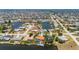 Aerial shot of the property showing its waterfront location, pool, and access to the canal with a private dock at 805 Brenda Ct, Punta Gorda, FL 33950