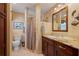 Bathroom featuring tile floors, granite counters, and a walk-in shower at 805 Brenda Ct, Punta Gorda, FL 33950
