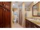 Bathroom featuring tile floors, granite counters, and a walk-in shower at 805 Brenda Ct, Punta Gorda, FL 33950