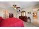 Bedroom with ceiling fan and ensuite bath at 805 Brenda Ct, Punta Gorda, FL 33950